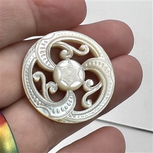 A 19th c. Carved pearl with open work and center star.