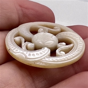 A 19th c. Carved pearl with open work and center star.