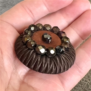 A 19th c. Fabric button with big faceted black glass beads.