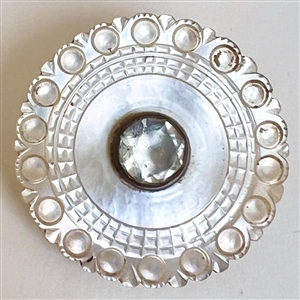 An 18th c. Carved pearl button with faceted paste center. 