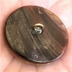 A 19th c. Carved pearl button of “man in the moon with enamel sky and stars.