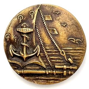 A 19th c. Brass button of fouled anchor and sea scene from ship. 