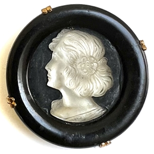 French Casein button with frosted glass profile of a woman.