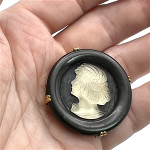 French Casein button with frosted glass profile of a woman.