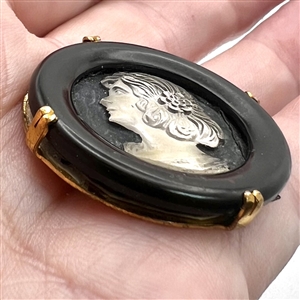 French Casein button with frosted glass profile of a woman.