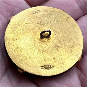 French Casein button with frosted glass profile of a woman.