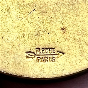 French Casein button with frosted glass profile of a woman.