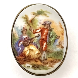 Porcelain oval button of a man and woman done in “Watteau" style.
