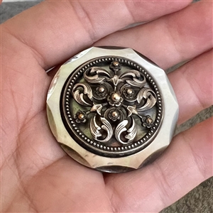 A 19th c. pearl button with silvered brass OME.