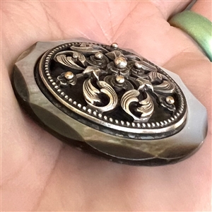 A 19th c. pearl button with silvered brass OME.