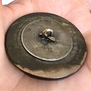 A 19th c. pearl button with silvered brass OME.