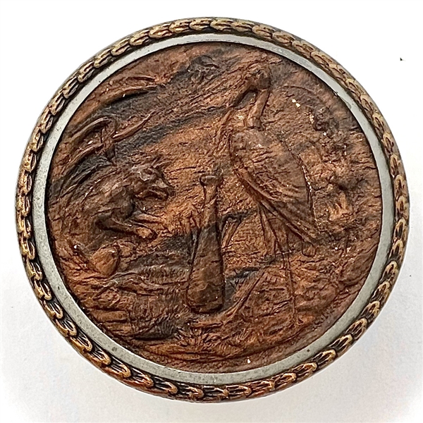 A 19th c. Fable button of fox and stork in molded wood.