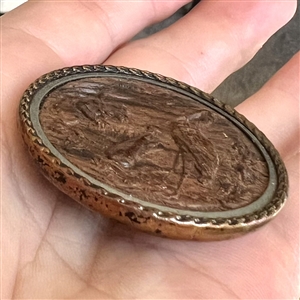A 19th c. Fable button of fox and stork in molded wood.