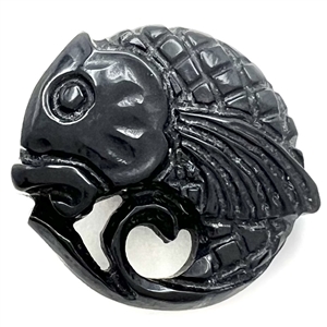 Pierced casein button of a realistic fish. 
