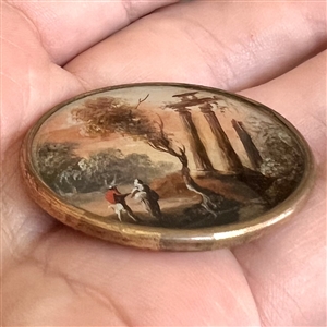 An 18th c. Painting under glass of a couple visiting ruins.