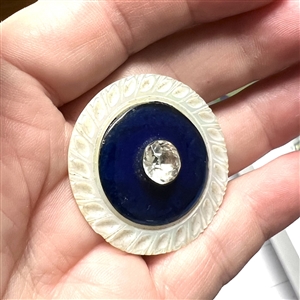 An 18th c. pearl with cobalt glass center and paste pin shank.