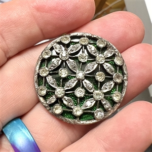 Beautiful open work with pastes over green glass set in metal.