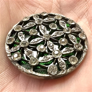 Beautiful open work with pastes over green glass set in metal.