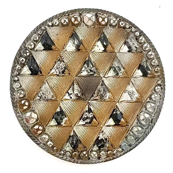Lacy glass button of a pattern of triangles. 