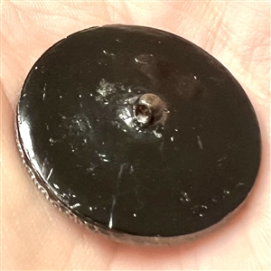 Lacy glass button of a pattern of triangles. 
