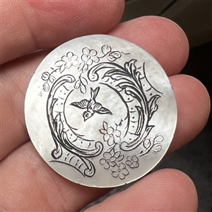 Late 19th c. Pearl button of a bird flying through a trestle.