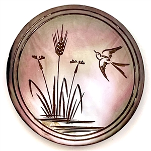 Engraved smoky pearl button of water plants and flying swallow.