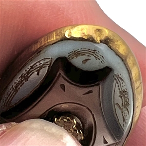 Late 19th c. Carved pearl button in metal with oval center of pastes. 