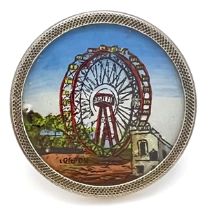 Painting under glass set in metal of “The Great Wheel." 