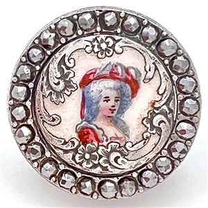 Enamel on white metal button of a woman in hat with border of faceted cut-steels.