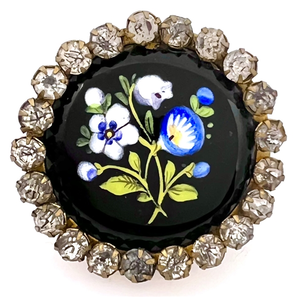 Enamel button of flowers with paste border.