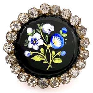Enamel button of flowers with paste border.
