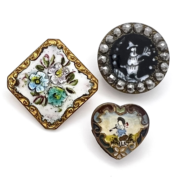 Three fun enamel buttons.