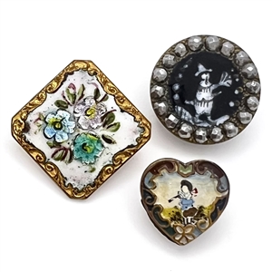 Three fun enamel buttons.