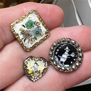 Three fun enamel buttons.