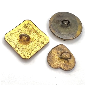 Three fun enamel buttons.