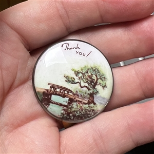 Motiwala enamel button of a bridge and tree and verbal “Thank you!