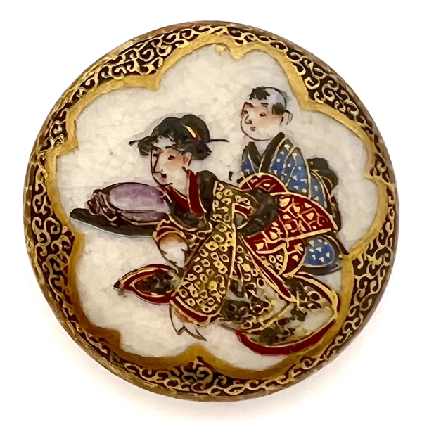 “Naughty" Satsuma button of man and woman interacting.
