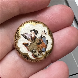 “Naughty Satsuma button of man and woman interacting.