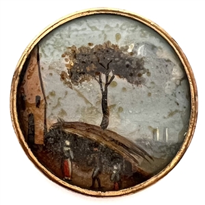 An 18th c. Painting under glass button of people looking toward ships on horizon. 
