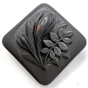 Large gutta percha flower and leaf button. 