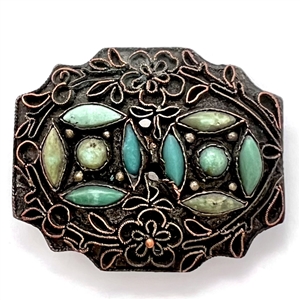 Applied filigree over metal with turquoise button. 