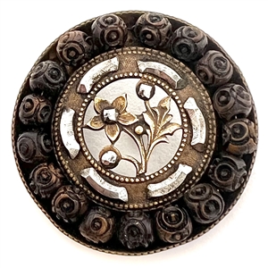Lovely brass button with cut steels, wood and plant life center with open work.