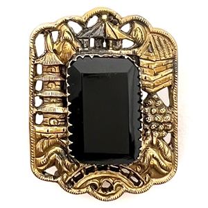 Fabulous button of silver with gold vermeil of Asian architecture with black glass center.