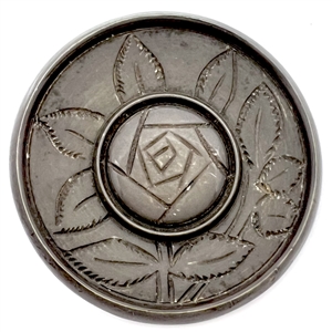Couture casein button of a rose by Henri Hamm. 