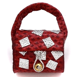 Adorable leather studio button of a purse by Nancy Dubois.