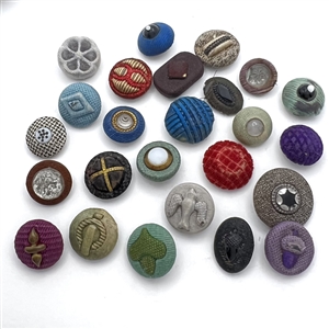 Twenty five Div I fabric buttons including fancy tops.