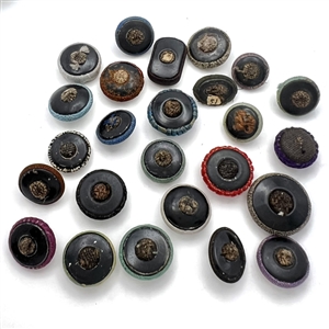 Twenty five Div I fabric buttons including fancy tops.