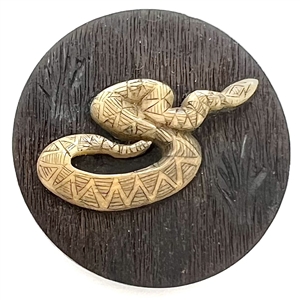 Leo Crabtree studio button of a snake.