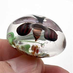 Will Stokes glass paperweight studio button of a thistle and butterfly.
