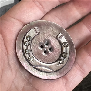 Cameo carved pearl button of a horseshoe with pastes.